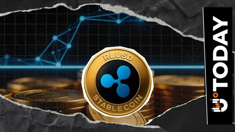 Physische Krypto-Münze mit Ripple-Logo vor einem aufsteigenden Kurs-Chart