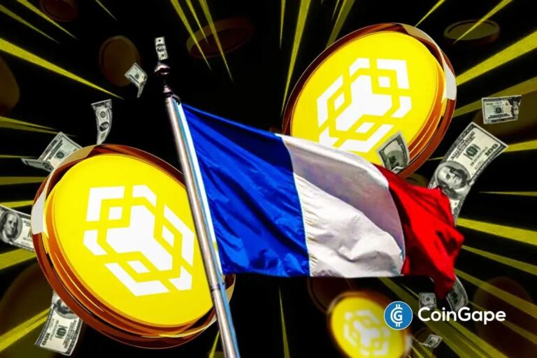 Binance-Logo auf einem Smartphone vor dem Hintergrund eines Kurs-Charts