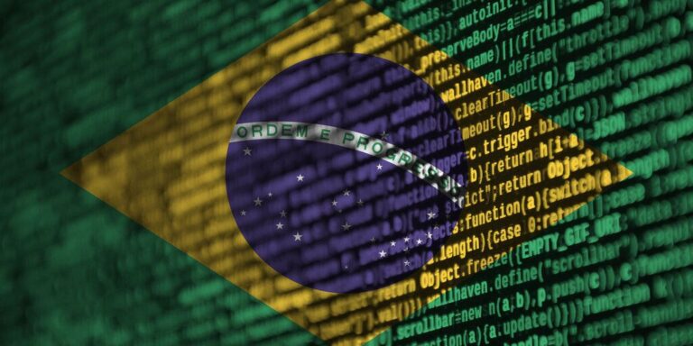 Die brasilianische Flagge überlagert mit einem Tether-Logo vor einem abstrakten Finanz-Chart.